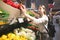 Woman chooses vegetables on the supermarket shelves. Girl buys the pepper in the vegetable department