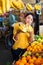 Woman choosing bananas in fruit and vegetable section of supermarket