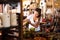 Woman choosing ceramics in pottery store