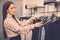 Woman choosing clothes in a showroom