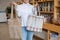 Woman choosing cotton bag at eco-friendly store