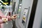 Woman choosing the destination on subway train ticket machine. Transportation concept