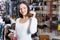 woman choosing different earrings