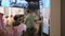 Woman Choosing Food Via Self-Service Machine at Fast Food Restaurant . People Using Self-Service Touch Terminal Makes a