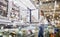 Woman choosing ice cream at grocery store freezer