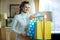 Woman choosing like clothes shopping bags hanging on rail