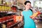 Woman choosing pack of spaghetti