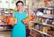 Woman choosing pack of spaghetti