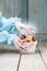 Woman choosing peaches from wicker basket