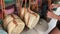 Woman choosing rattan eco bags in the art shop on Bali island, Indonesia. Woman stylish eco bag.