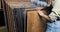 Woman choosing wood texture laminate floor in flooring store