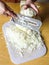 Woman chopping cabbage on cutting board