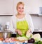 Woman chopping cabbage for soup