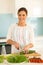 Woman chopping cucumber