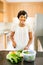 Woman chopping cucumber