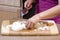 Woman chopping onions in kitchen 2