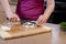 Woman chopping onions in kitchen 3