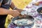 Woman chopping onions in tray. Chop onions