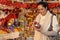 Woman at Christmas decoration shop with balls