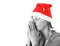 woman with christmas hat praying stock photo