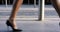 Woman, city and walking in street with stilettos to business, work or job in finance company. Closeup, feet and formal