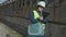 Woman civil engineer examining wall condition