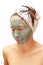 Woman with a clay mask