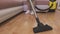 Woman clean floor with vacuum cleaner