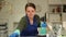 Woman cleaner polishing table in office