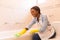 Woman cleaning bathtub