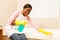 Woman cleaning bathtub