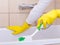 Woman cleaning bathtub