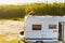 Woman cleaning caravan roof