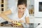 woman cleaning ceramic hob in home