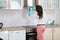 Woman Cleaning Cooker Hood With Rag
