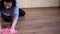 Woman cleaning the floor with microfiber rag at home, housekeeping