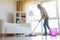 Woman cleaning floors at home