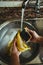 Woman cleaning food to prevent the spread of the COVID-19 virus.