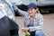 Woman cleaning front vehicle