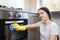 Woman cleaning kitchen