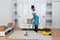 Woman Cleaning Living Room