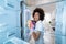 Woman Cleaning Refrigerator With A Spray Detergent