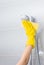 Woman cleaning a shower fixture