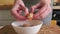 Woman cleaning shrimps for cooking. Process of hands peel shrimps shell