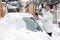 Woman cleaning snow