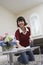 Woman Cleaning Table At Home