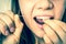 Woman cleaning teeth with dental floss - retro style