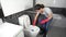 Woman cleaning toilet bowl with brush
