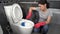 Woman cleaning toilet bowl with brush