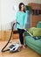 Woman cleaning with vacuum cleaner